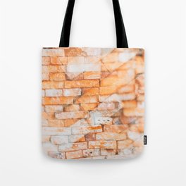 Retro style background or texture in double exposure. The stonewall from old orange bricks.  Tote Bag