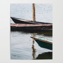 Parked Abandoned Wooden Fishing Boats on a River Poster
