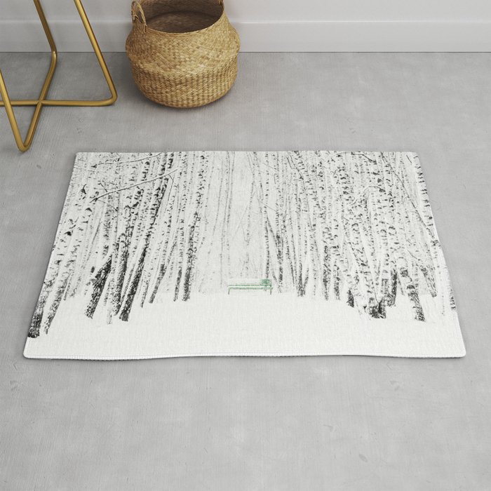 Green bench in white winter forest Rug