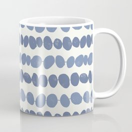 Pebbles - blue pebbles on a string with a cream background Mug