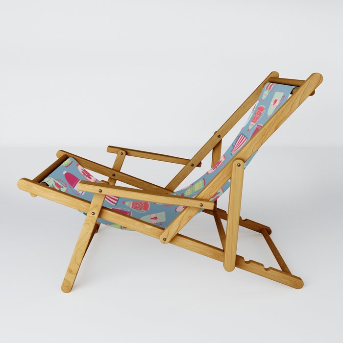 China Teacups On Teal Sling Chair By Squirrell