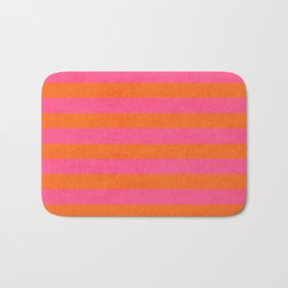 hot pink and orange stripes Bath Mat