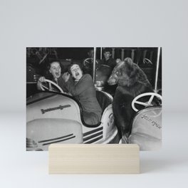 Bear with me; bear riding bumper cars scary women at carnival vintage black and white photograph - photography - photographs wall decor Mini Art Print