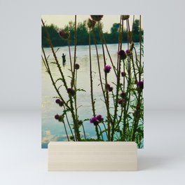 fisherman through thistle Mini Art Print