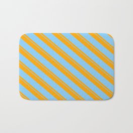 [ Thumbnail: Orange & Light Sky Blue Colored Striped/Lined Pattern Bath Mat ]