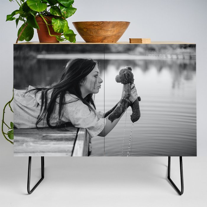 School daze; girl pulling childhood teddy bear out of lake breakup relationship female black and white photograph - photography - photographs Credenza