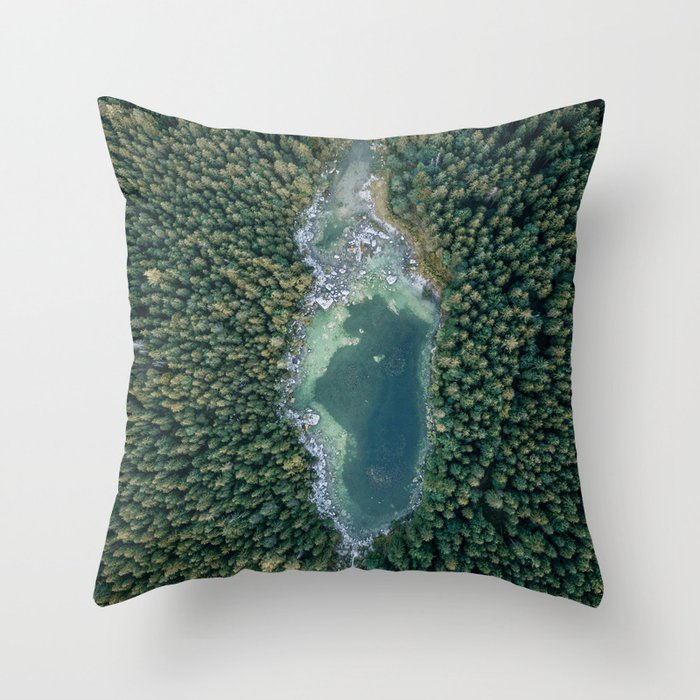 Aerial photo of a magic lake hidden inside a pine forest Throw Pillow