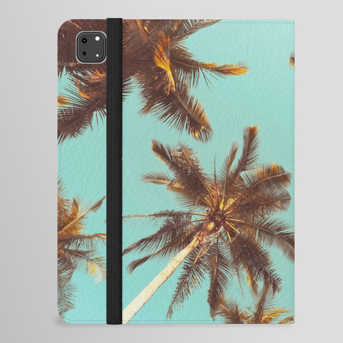 Tropical palm tree with blue sky and cloud abstract background. Summer vacation and nature travel adventure concept. Pastel tone filter effect color style.  iPad Folio Case