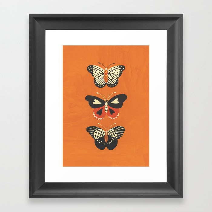 Butterflies in orange Framed Art Print