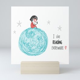 Girl reading in the Moon Mini Art Print
