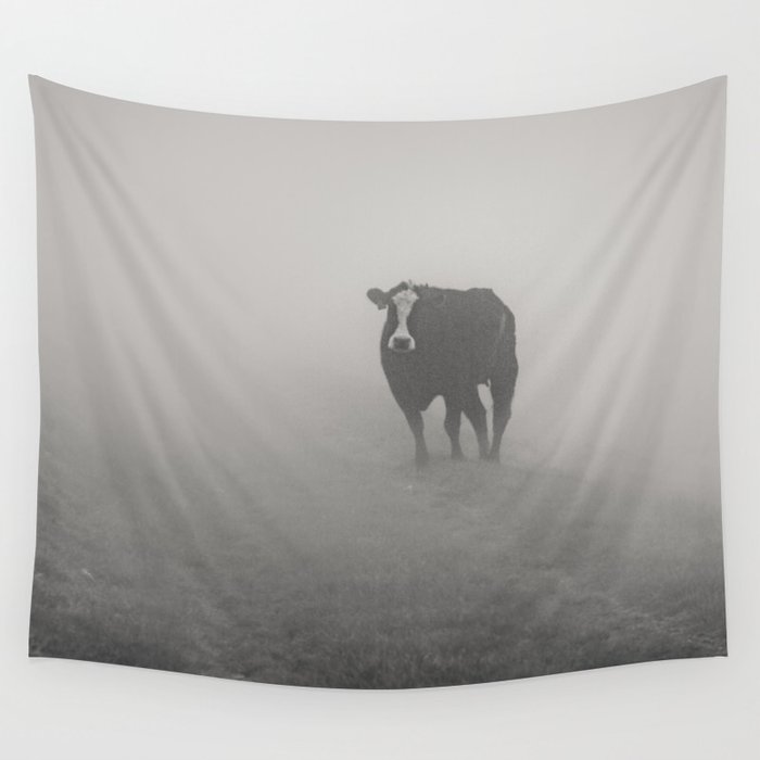Wandering bovine above the mist Wall Tapestry