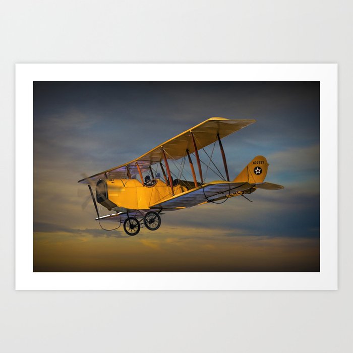 Yellow Biplane with Sunset Cloudy Sky Art Print