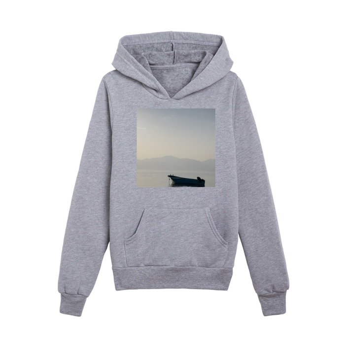boat in middle of sea with mountains behind it in egypt  Kids Pullover Hoodie