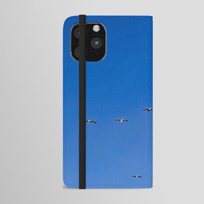 pelican migration, bright blue skies iPhone Wallet Case