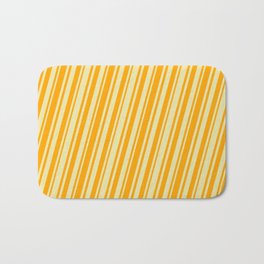 [ Thumbnail: Pale Goldenrod and Orange Colored Lined/Striped Pattern Bath Mat ]