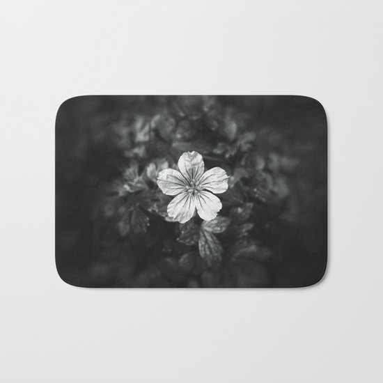 Minimalistic black and white flower petal Bath Mat