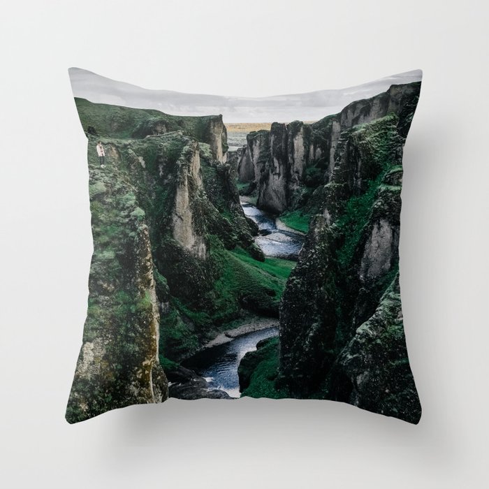 Fast flowing river making (wending) it’s way between two massive rock formations Throw Pillow