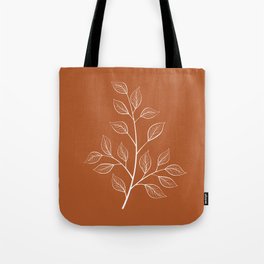 Delicate White Leaves and Branch on a Rust Orange Background Tote Bag