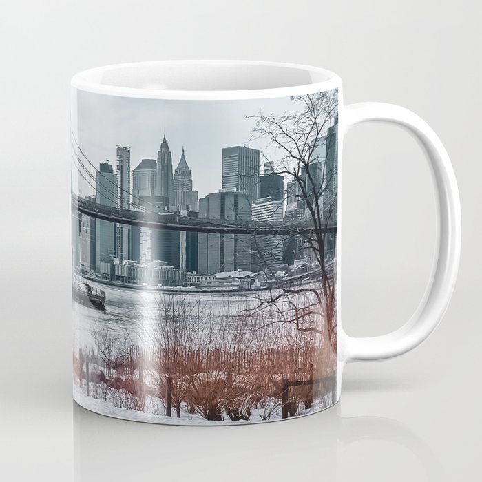 Brooklyn Bridge during winter snowstorm blizzard in New York City Coffee Mug