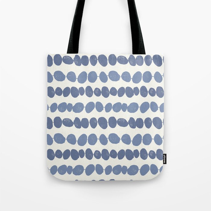 Pebbles - blue pebbles on a string with a cream background Tote Bag