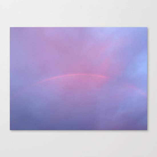 A Rainbow In A Sky Colored By The Sunset Canvas Print