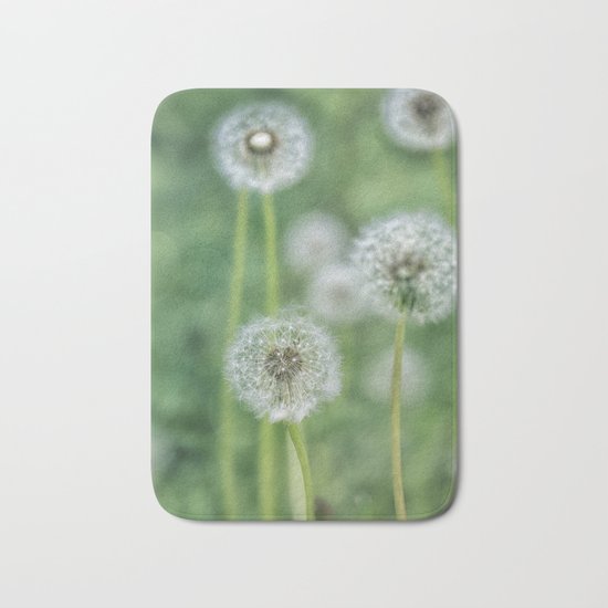 Dandelion flower on green meadow Bath Mat