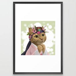 A cat wearing an 'ayam' Framed Art Print