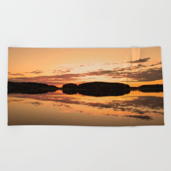 Beautiful sunset - glowing orange - forest silhouette and reflection Beach Towel