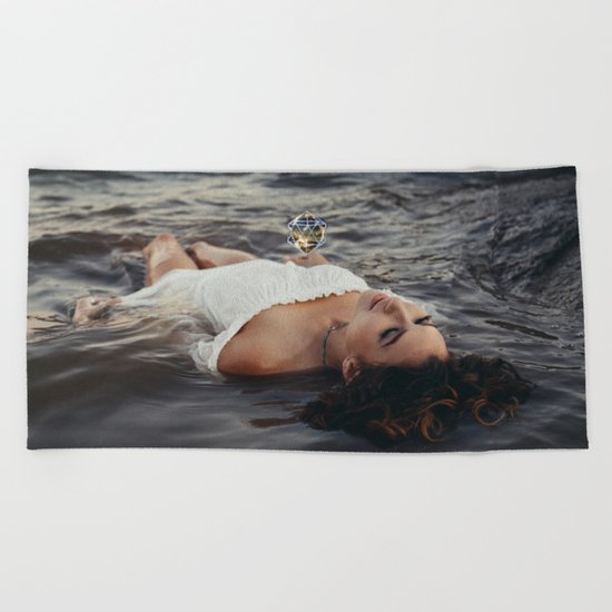 floating light Beach Towel