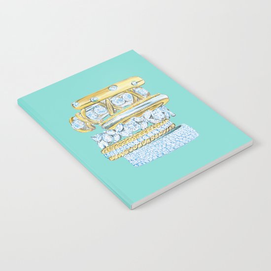 Golden Rings on Blue Notebook