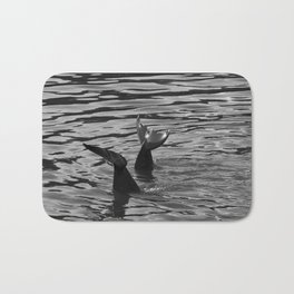 Two dolphins playing in the sea | Dolphin tail | Black and white nature photography Bath Mat