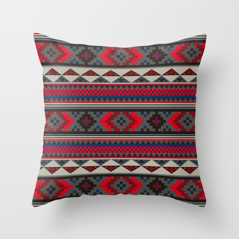 red throw blanket and pillows