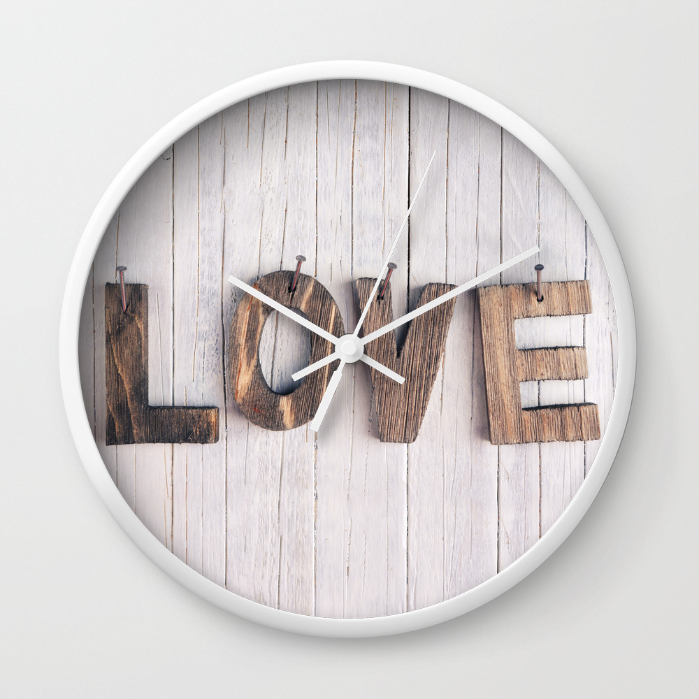The Word Love In Wooden Letters On A Rustic Background Wall