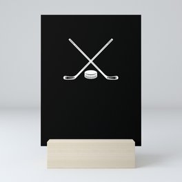 ice hockey bat and puck Mini Art Print