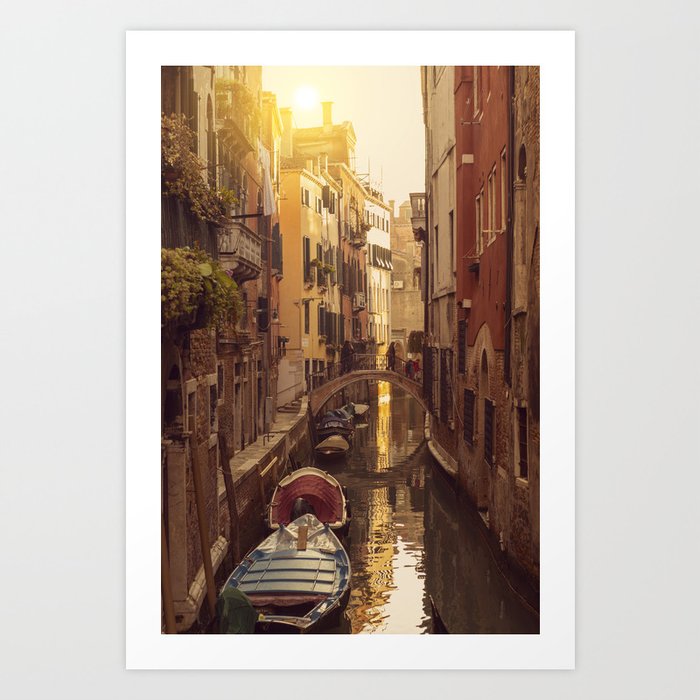 Boats in the canal in Venice with a little bridge over the water Art Print