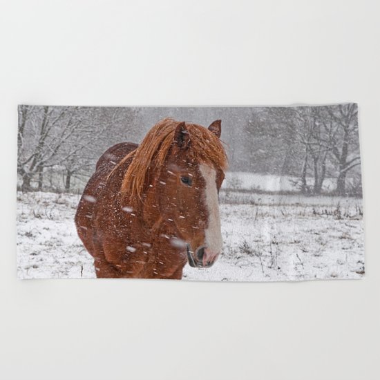 Horse in the snow Beach Towel