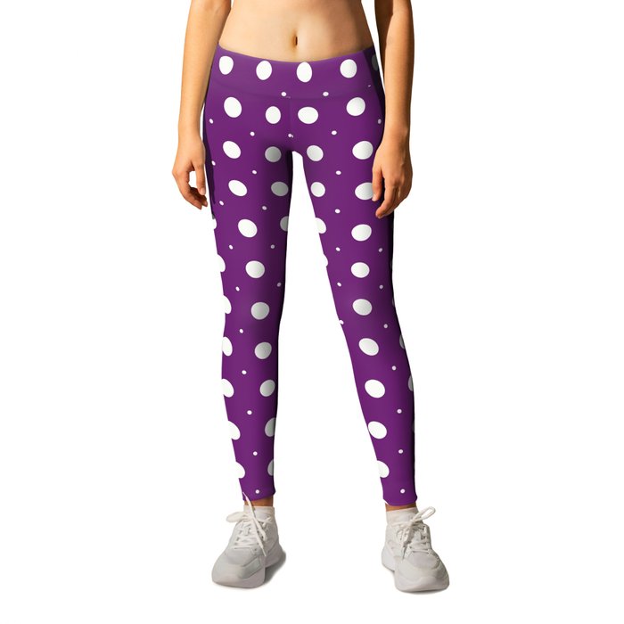 Beige circles of different sizes over purple background Leggings
