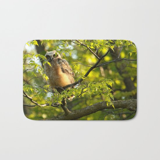 A peek between the leaves Bath Mat