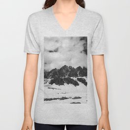 High sunlit rocks, snowy plateau with stones and cloudy sky in sunny winter day V Neck T Shirt