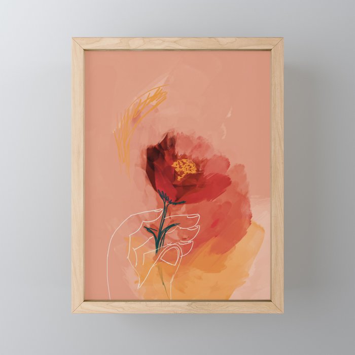 Hand Holding Flower Framed Mini Art Print