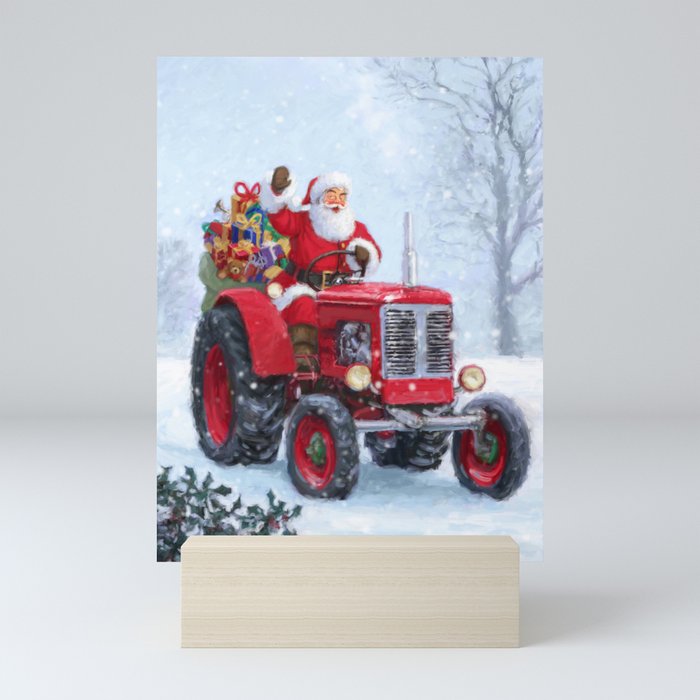Santa driving his tractor Mini Art Print