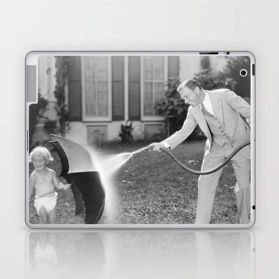 Always look on the bright side of life; little girl thwarting father with hose using umbrella humorous funny black and white photograph - photography - photograph Laptop & iPad Skin