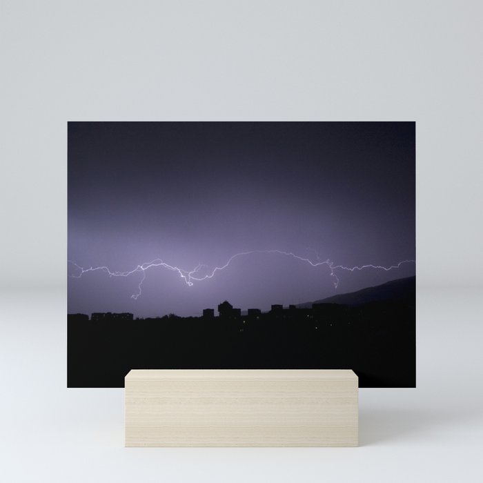 Lightning in a purple sky. Mini Art Print