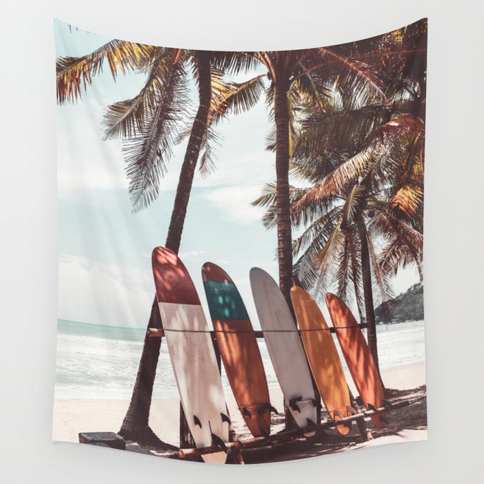Surfboard and palm tree on summer beach. Travel adventure sport and summer vacation concept. Vintage tone filter effect color style. Wall Tapestry