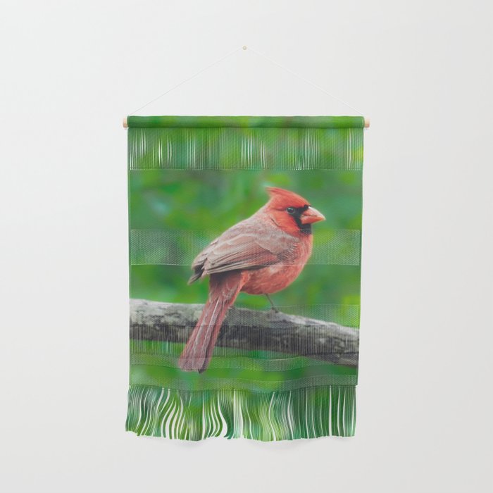 Red Cardinal against green leaves Wall Hanging