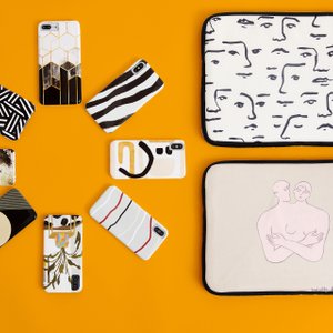 iphone cases and laptop sleeves on yellow background