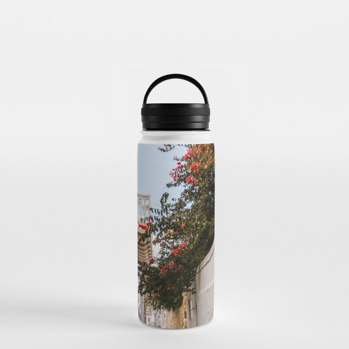 Small Greek Street | Flower Filled Mediterranean Ally | Travel Photography on the Islands of Greece Water Bottle