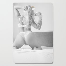 Woman in sexy lingerie posing on a bed  Cutting Board