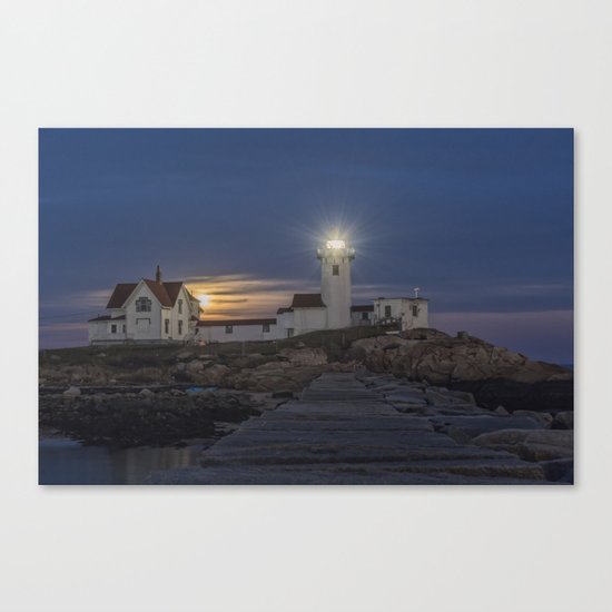 Full moon rising over Eastern point Lighthouse. Canvas Print