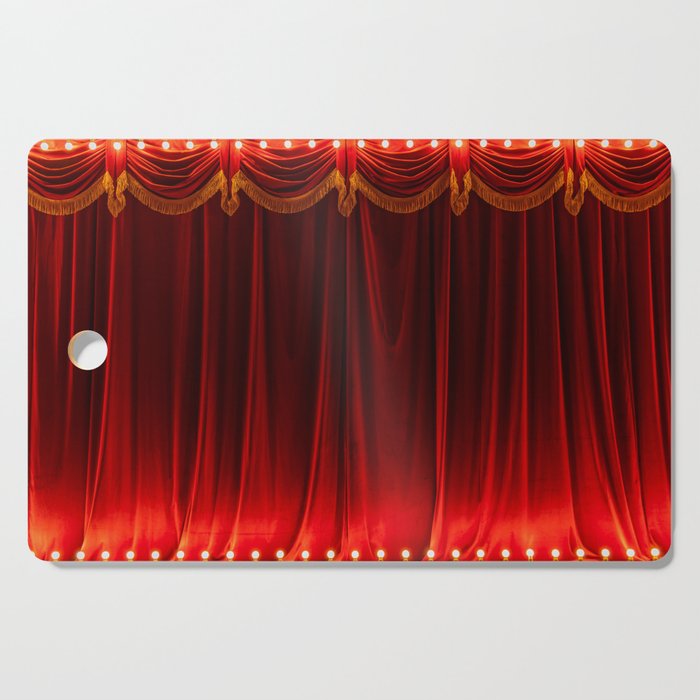 Theater red curtain and neon lamp around border Cutting Board